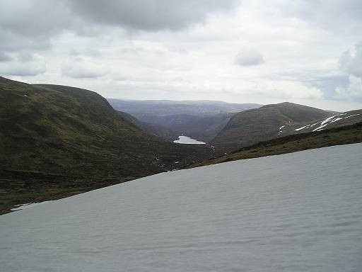 P1010170.JPG - Crossing a snow field to get to the third Monroe of the day. View to Dubh Loch.