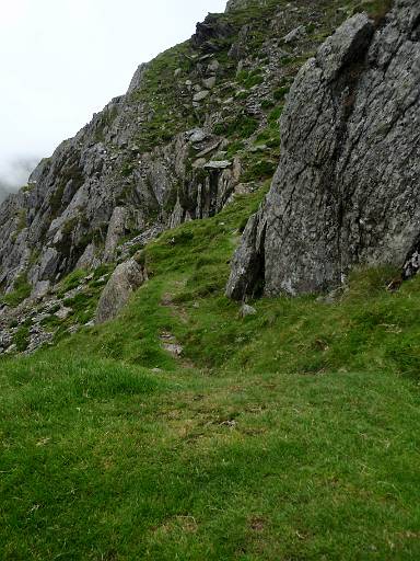 09_14-2.jpg - Turning left to follow the grassy path back to the top of the cliff