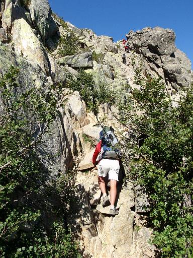 08_29-1.jpg - Phil starts the scrambling ascent heading towards the first chain of the route.