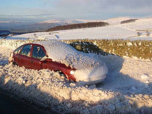 09_26-1.jpg - Car buried by snow plough on Sheffield Road near the Pennine Bridleway