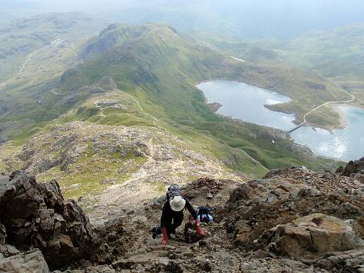 09_36-1.jpg - Phil scrambling up Crib Goch with view back to Pen Y Pass
