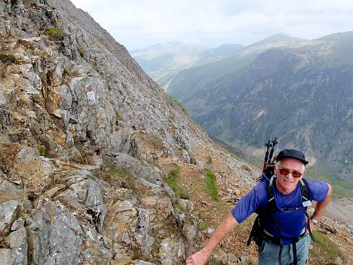 09_46-1.jpg - Paul contemplating next climb, with view into Llanberris Pass