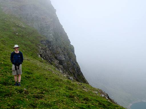 14_47-1.jpg - Richard with Y Lliwedd behind, and the first view of the reservoir as we descend from cloud